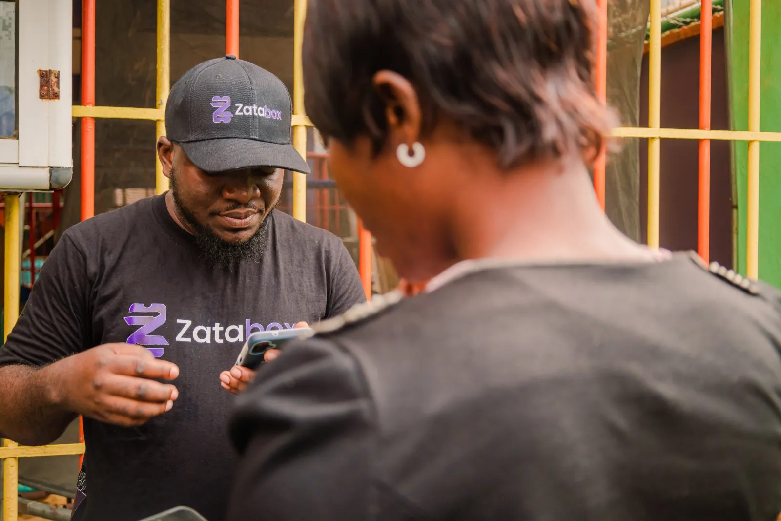 Attendees gathered at the venue entrance, scanning in via Zatabox.